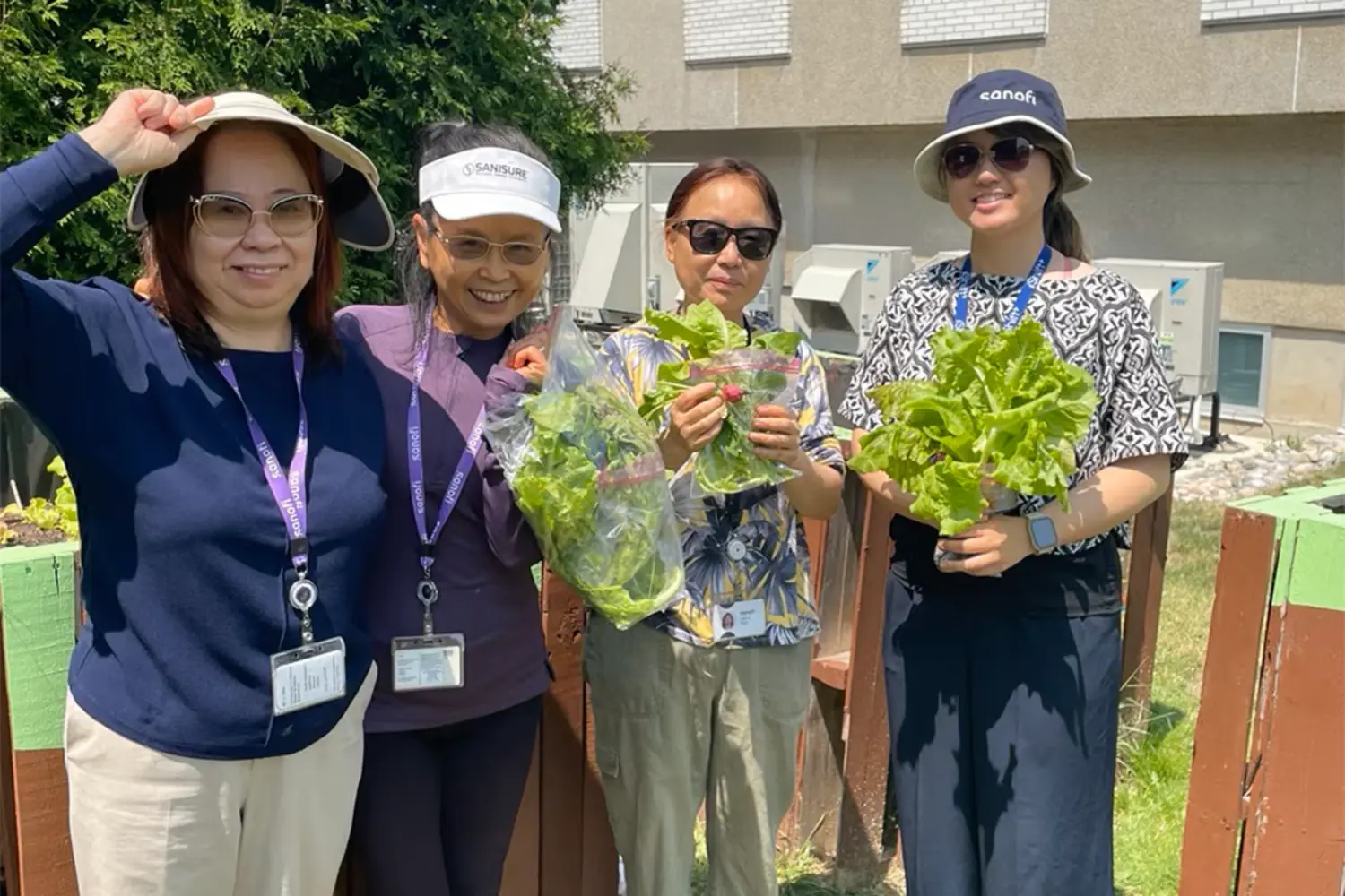 Team members helping our onsite eco-garden thrive