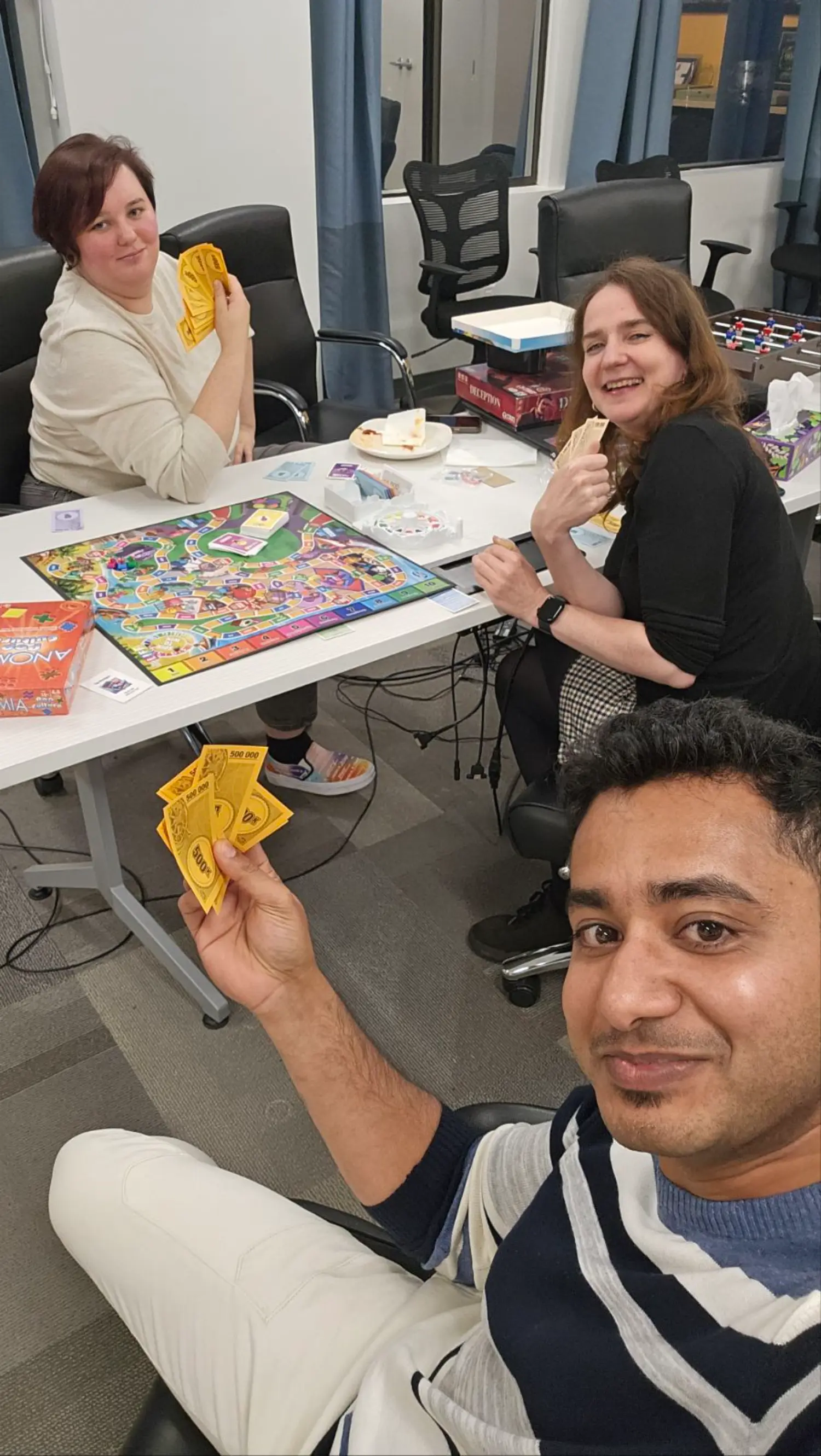 Enjoying a board game night at the AOT head office in Victoria, BC.
