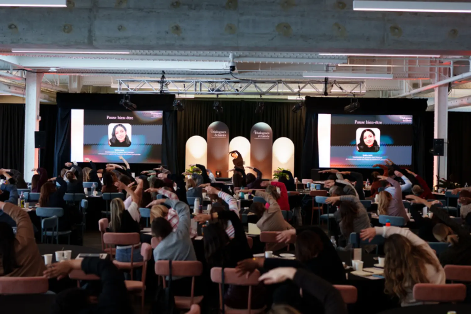 Clients and employees stretching during our annual Sparking Dialogues conference