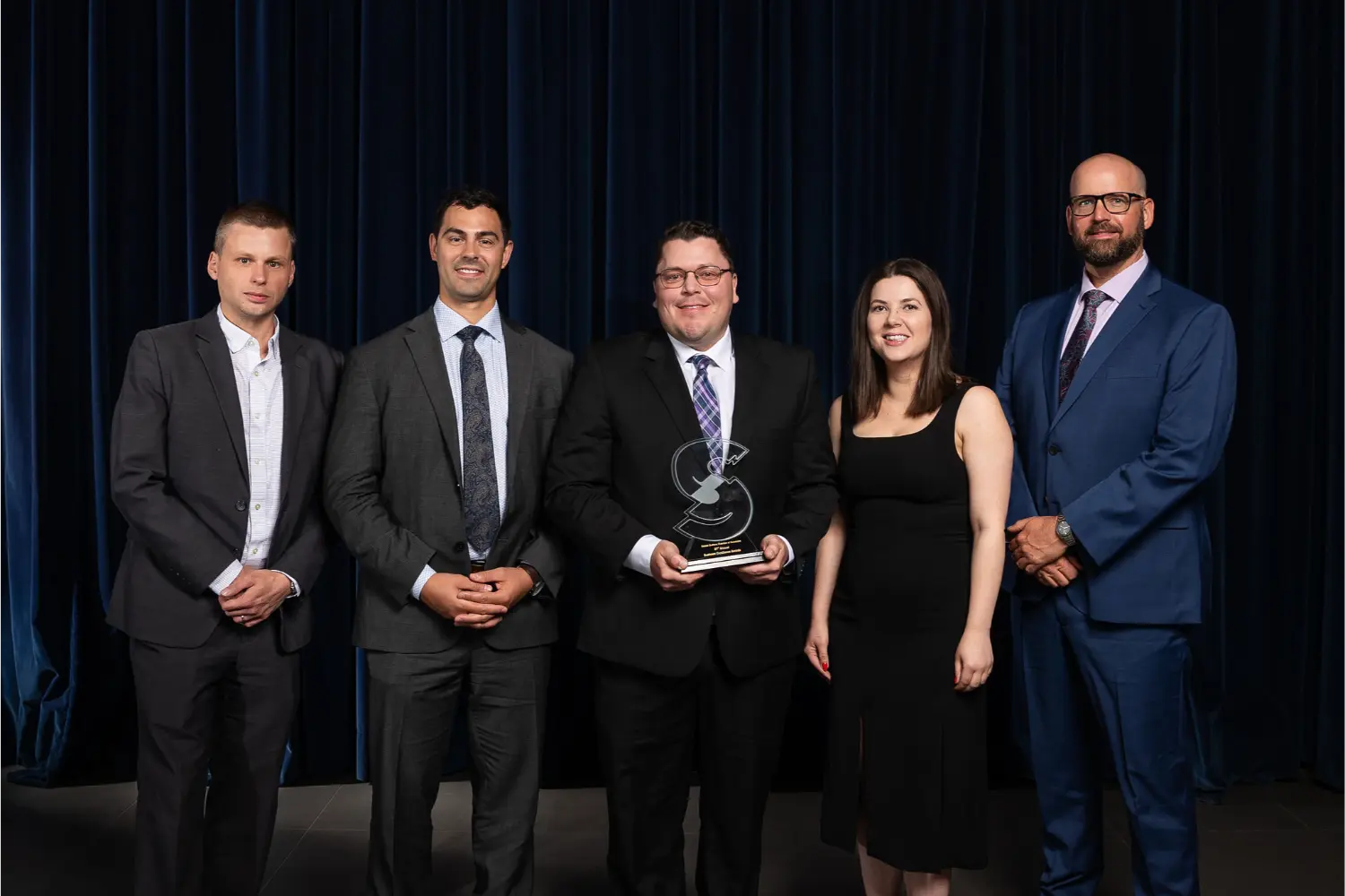 The team coming together to celebrate winning a community based award.