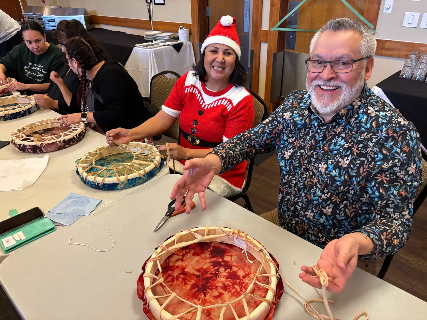 FNFA hosting cultural workshop for staff on making traditional drums.