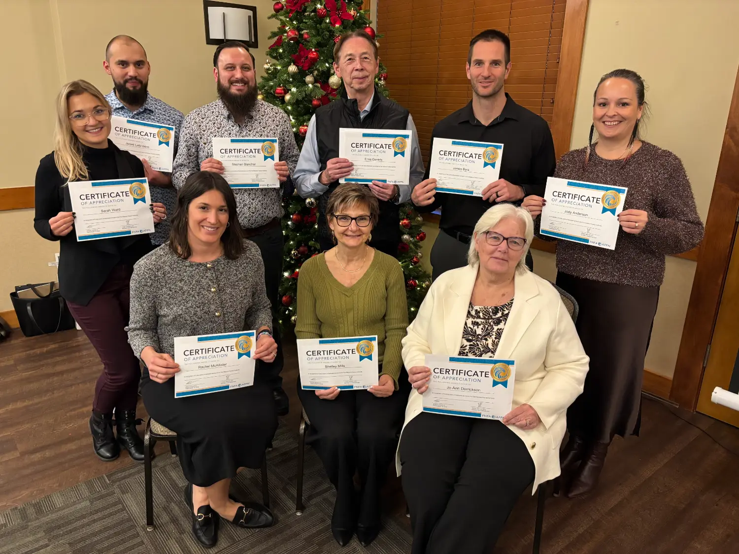 FNFA at staff retreat 2025, long service awards for employees ranging from five to 14 years of dedication.