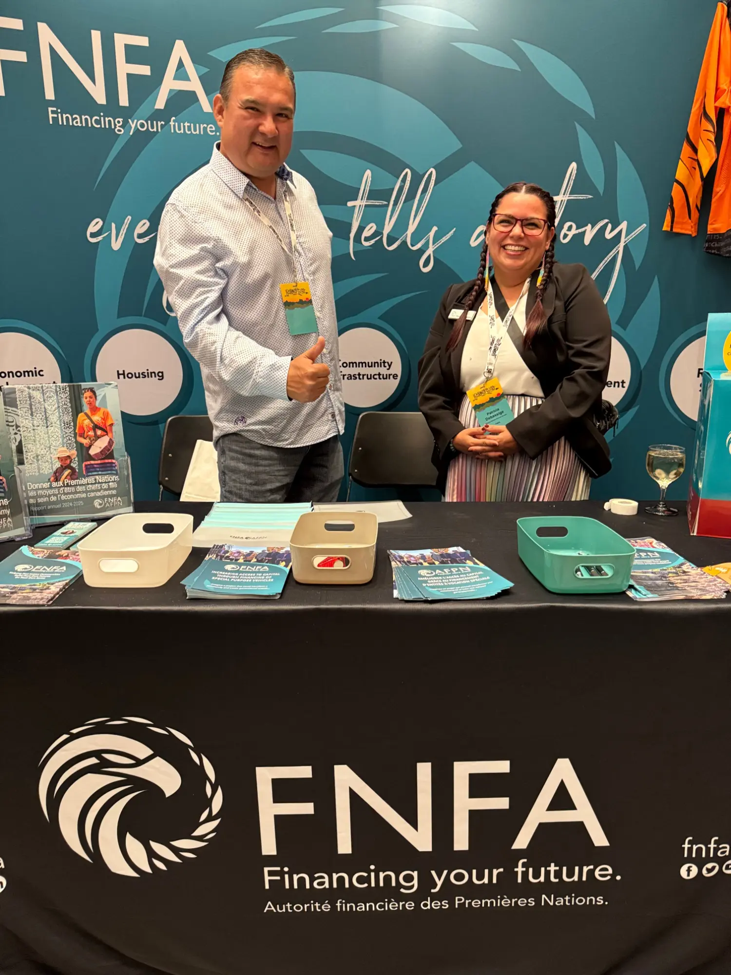 FNFA at First Nations Leading the Way National Conference welcoming delegates to the booth.
