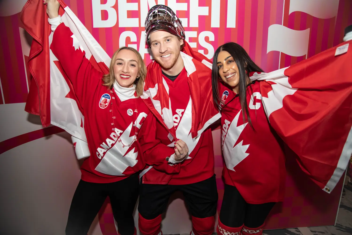 Some members of our Canada team showing Canadian pride at a Benefit event