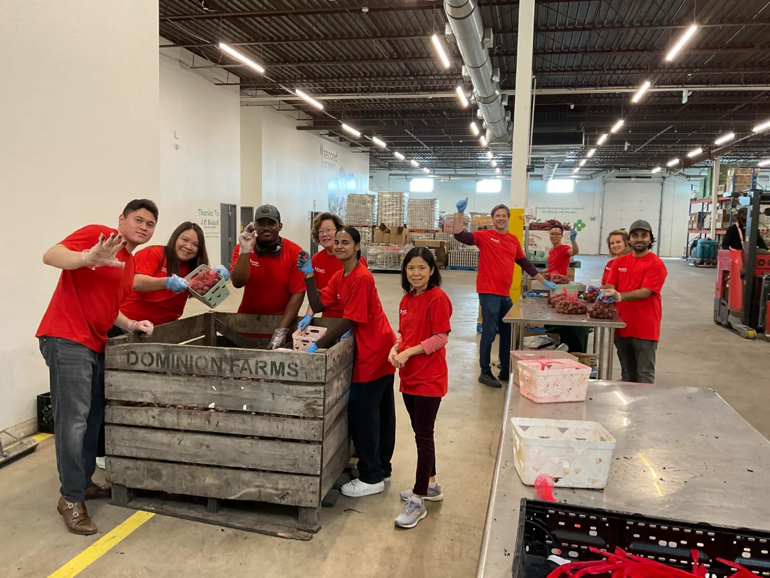 Another snapshot of team members sorting through food which will be delivered to food banks.