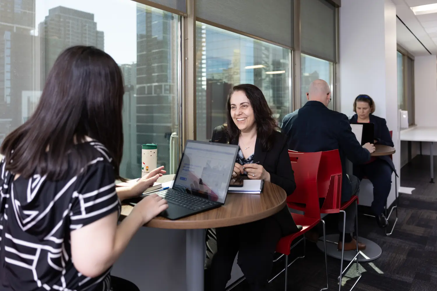 OMVIC employees ignite ideas and strategies in a dynamic office environment.