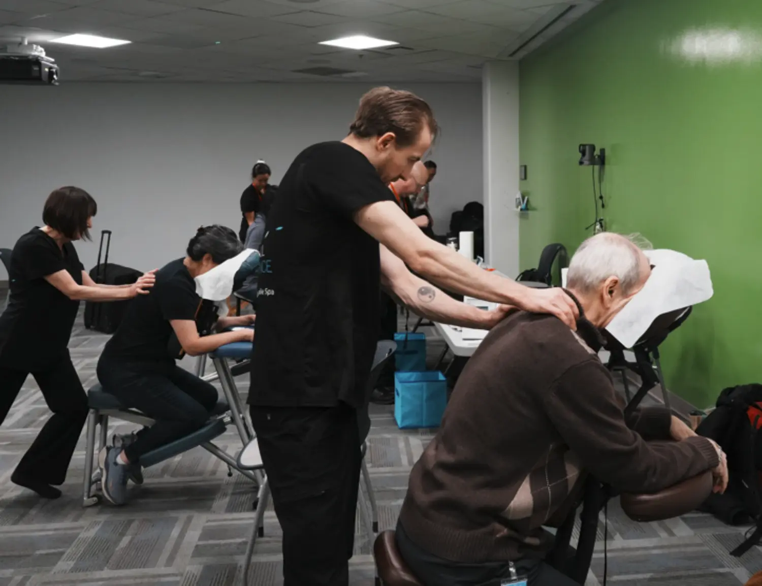 Head and shoulder massages help employees recharge and relax during Wellness Waves.