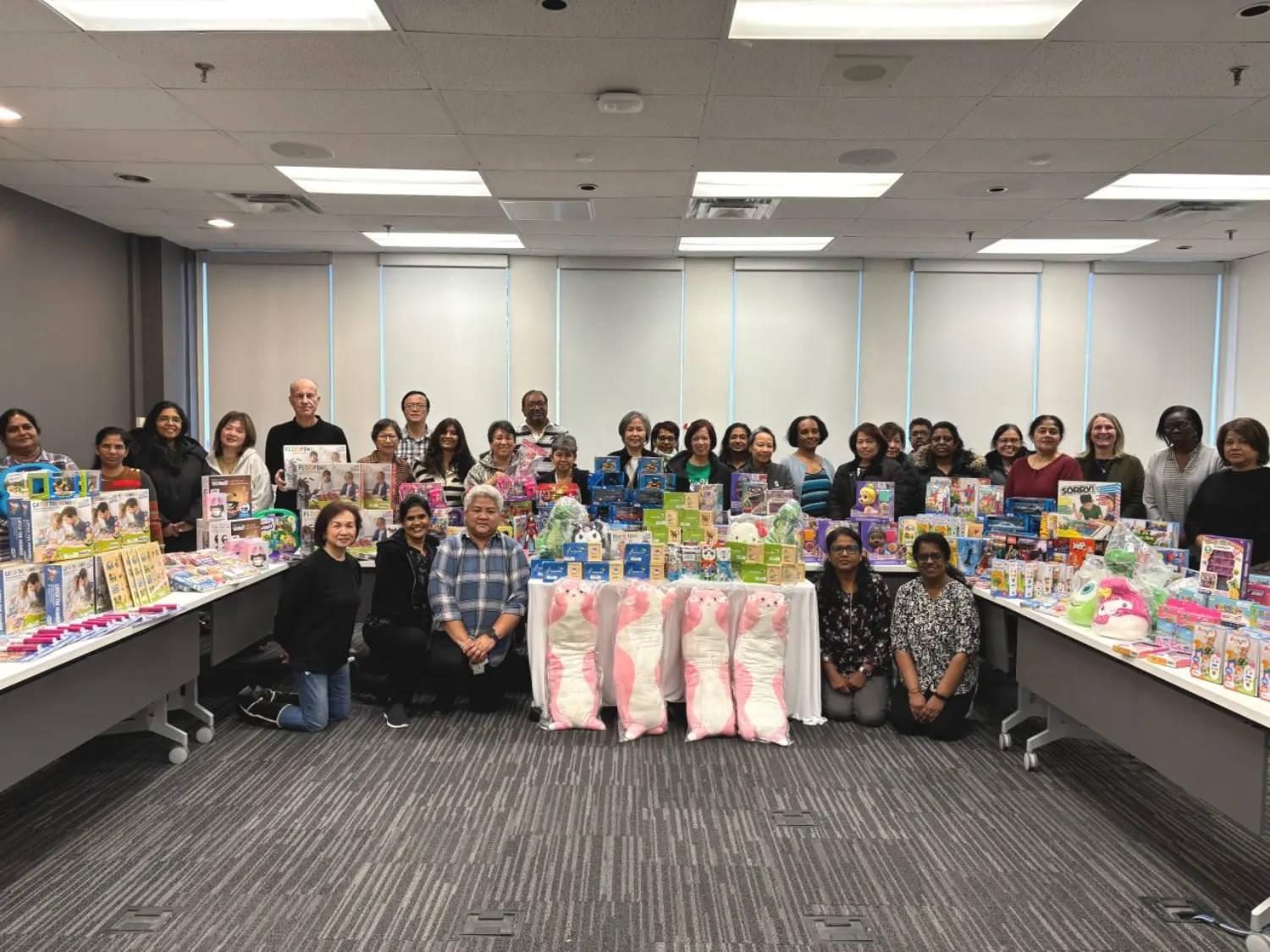 Volunteers gathered to wrap gifts and sponsor families in support of the Holiday Helpers initiative.