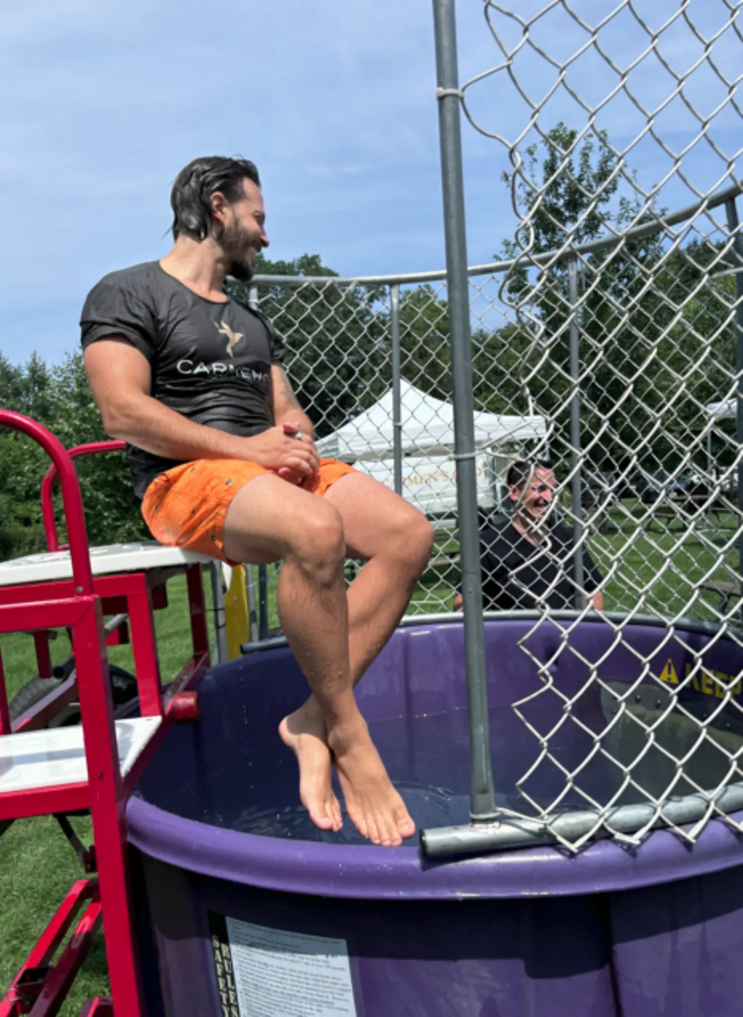 One of our owners, Joe Mercanti, in the dunk tank at the Company picnic