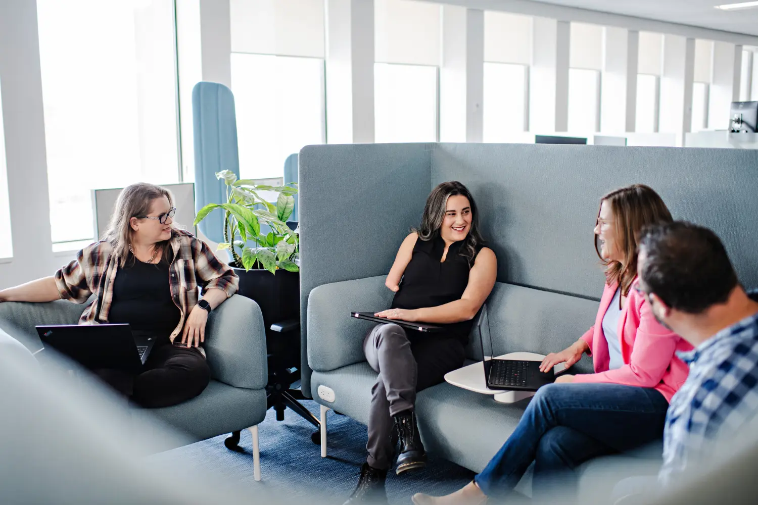 Definity employees collaborating in office