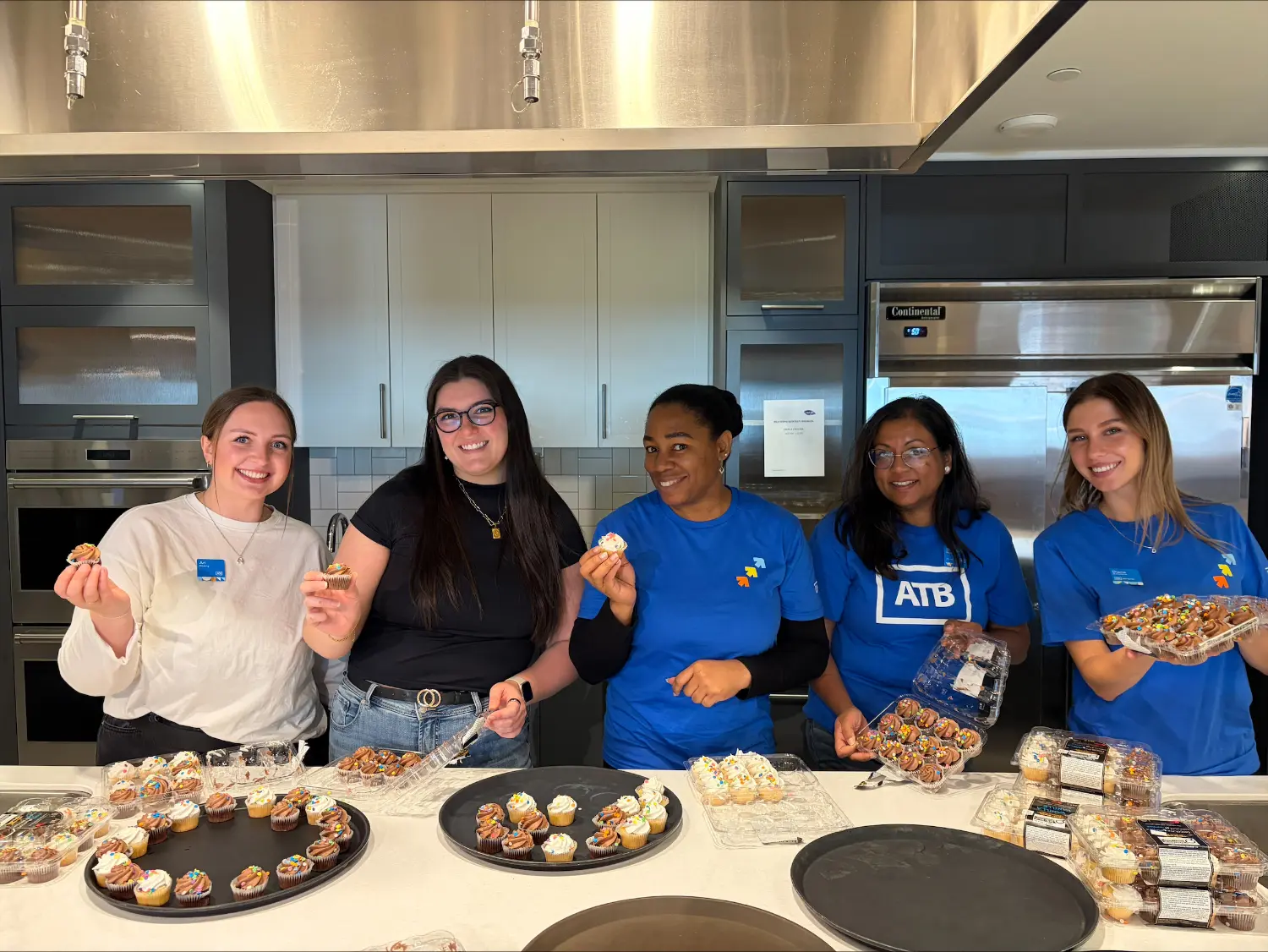 ATB team members smiling while volunteering at Carya in Calgary.