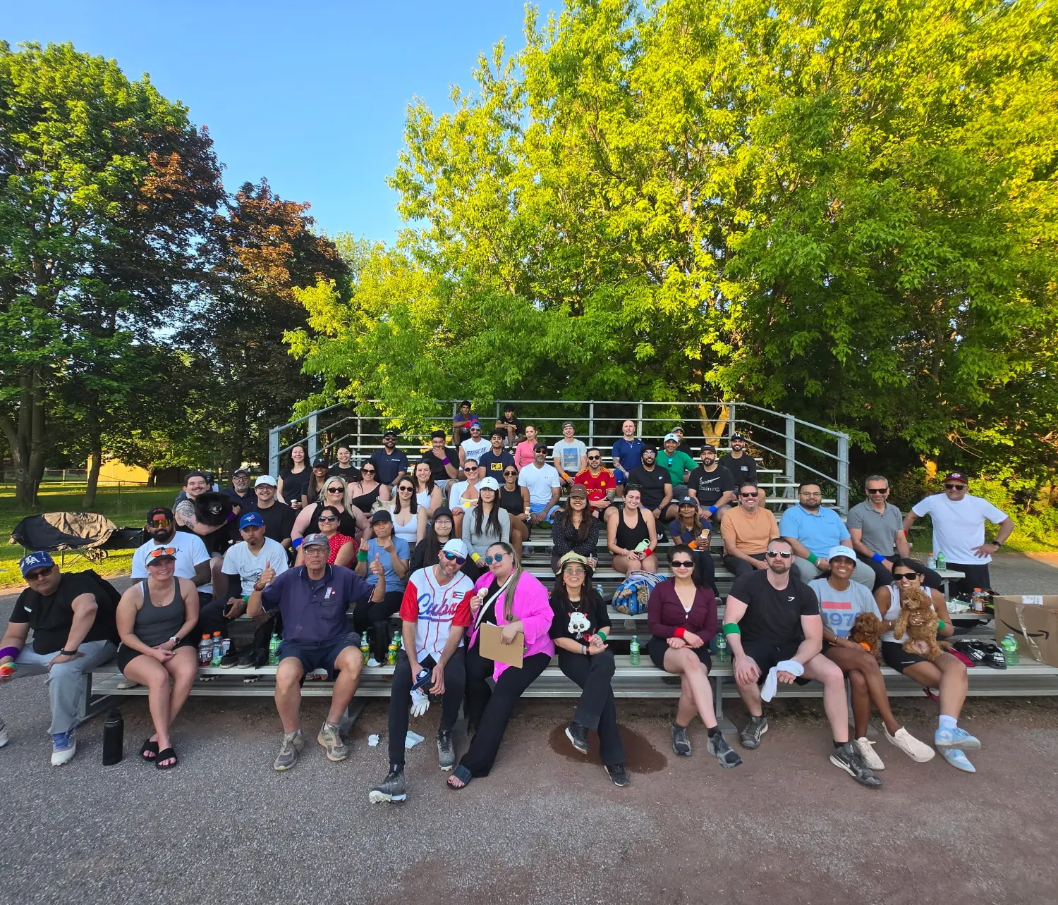 Group photo at the park where we hold our annual softball games.