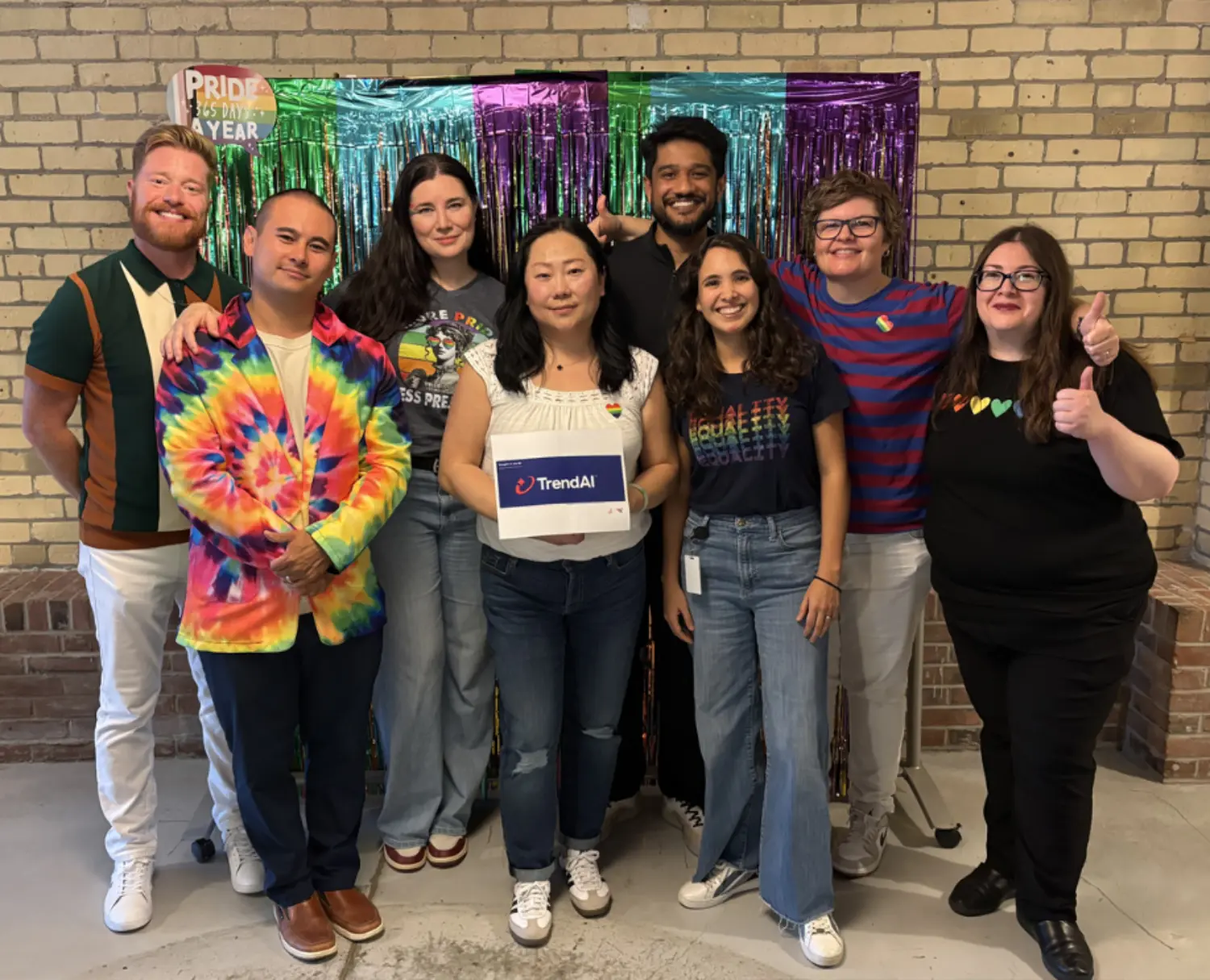 Team members coming together to celebrate Pride and foster a culture of belonging.