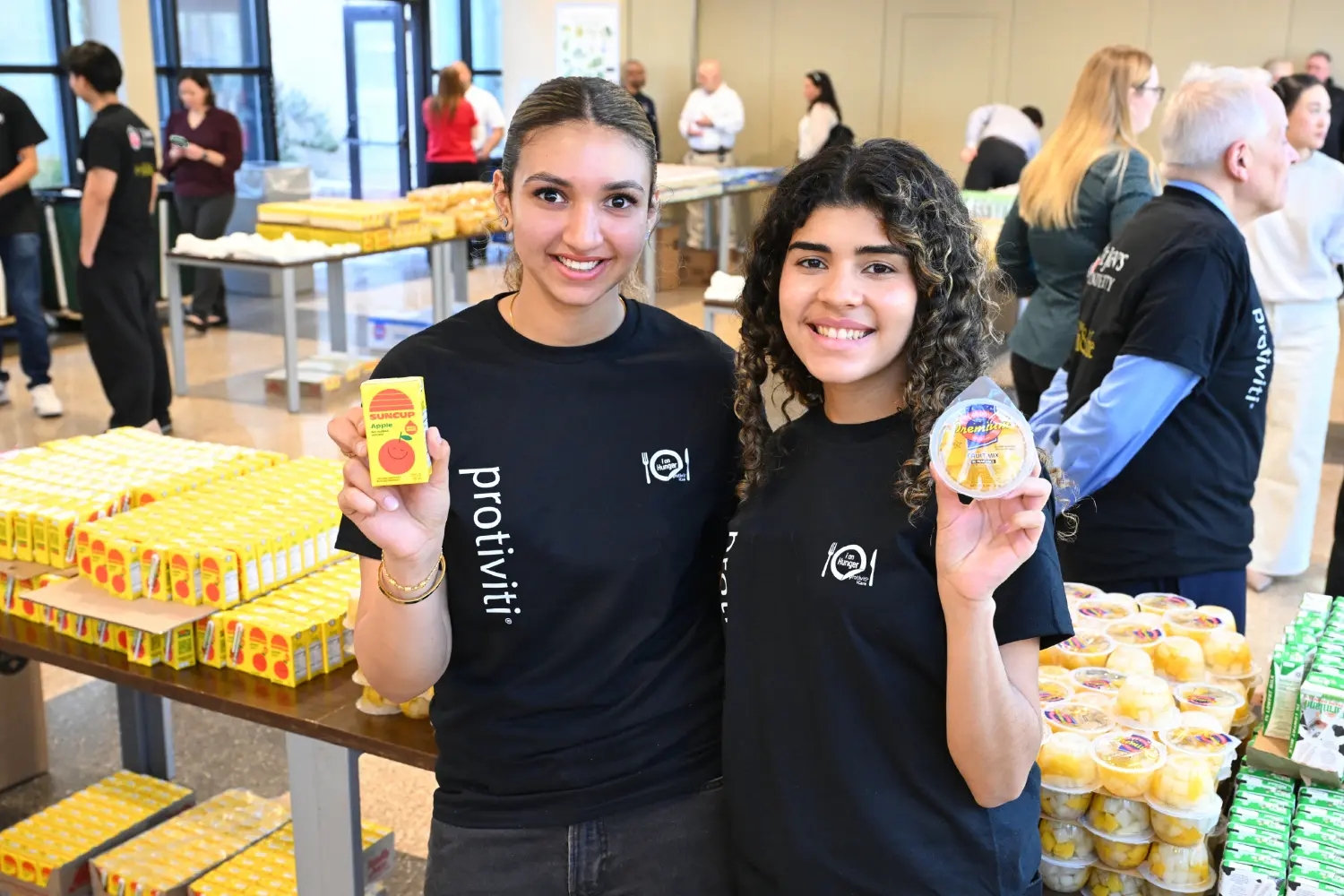 Our employees volunteer their time at food packing events throughout the year as part of our i on Hunger program.