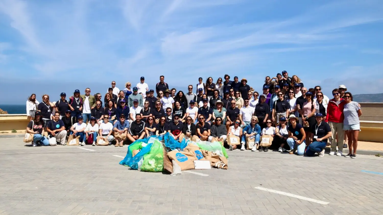 Building Healthier Communities: Colleagues spending quality time together while giving back at a local beach cleanup.