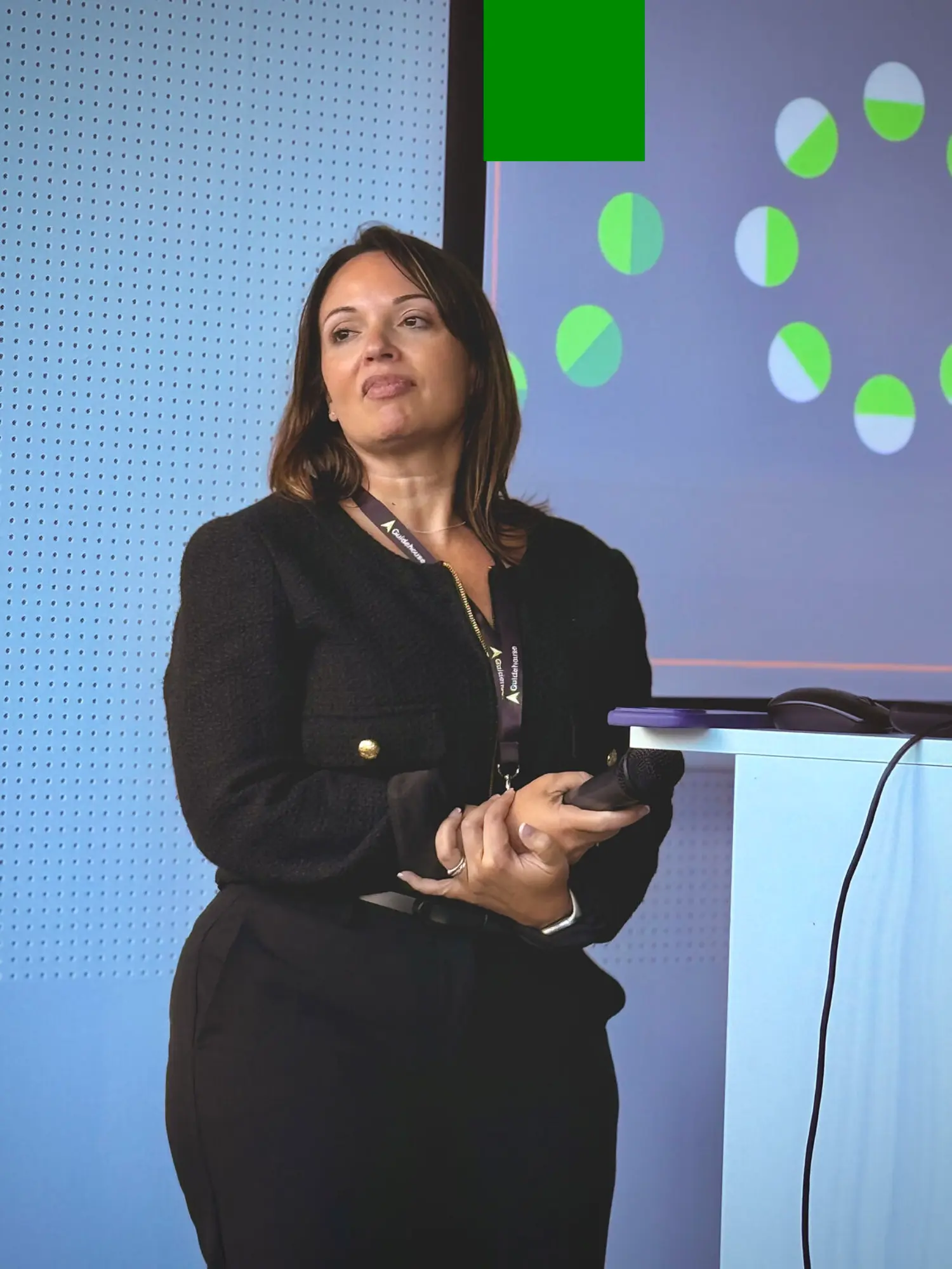 Jennifer Moltzan, CPO at a Guidehouse All Hands, celebrating connection, culture, and collaboration.