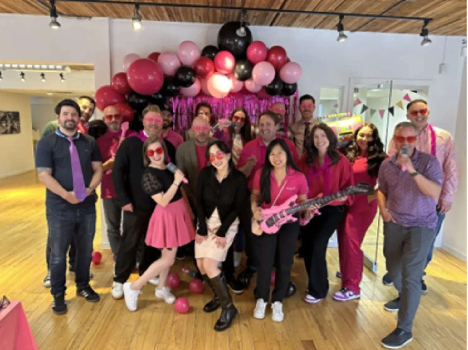 Teammates showing off their fuchsia