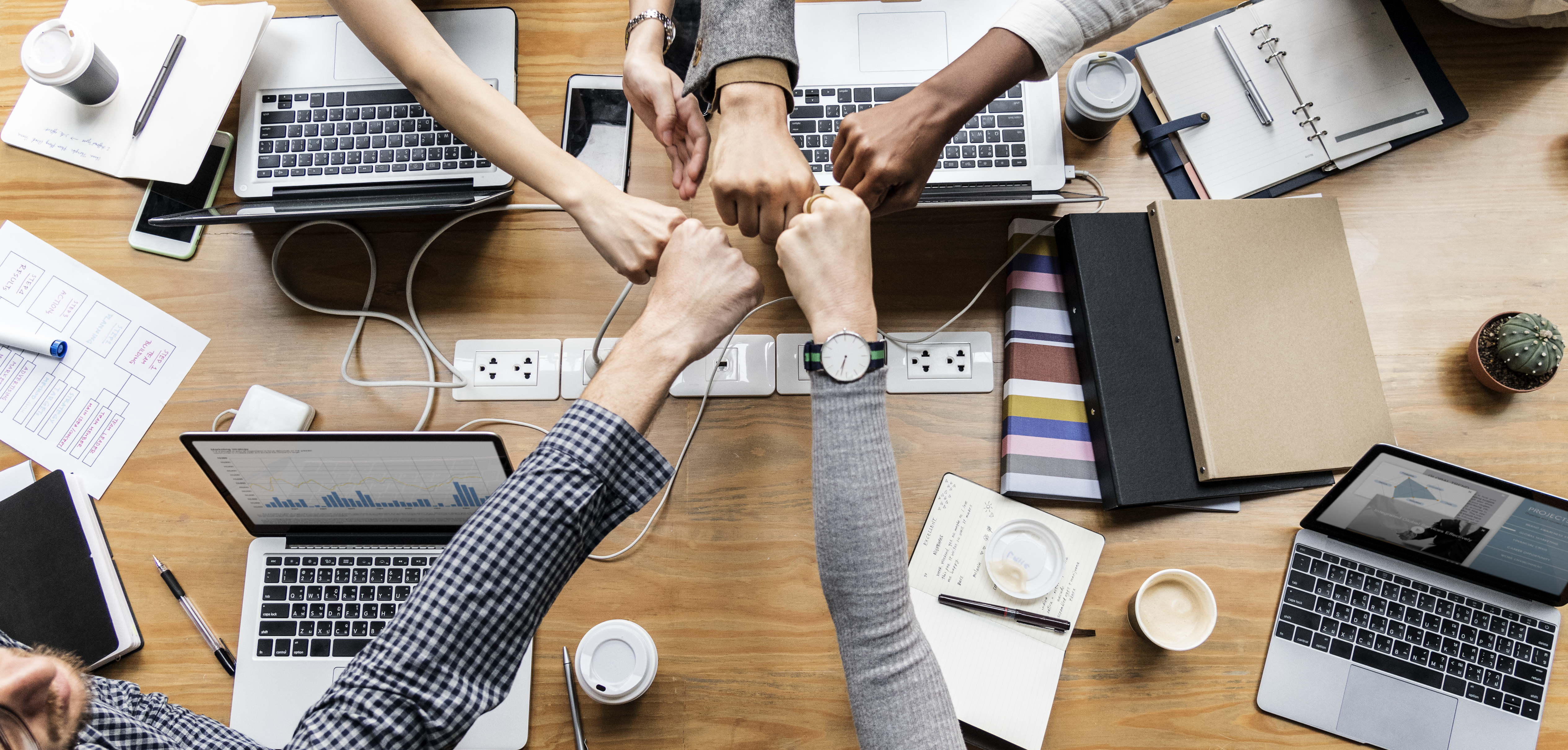 colleagues giving fist bump